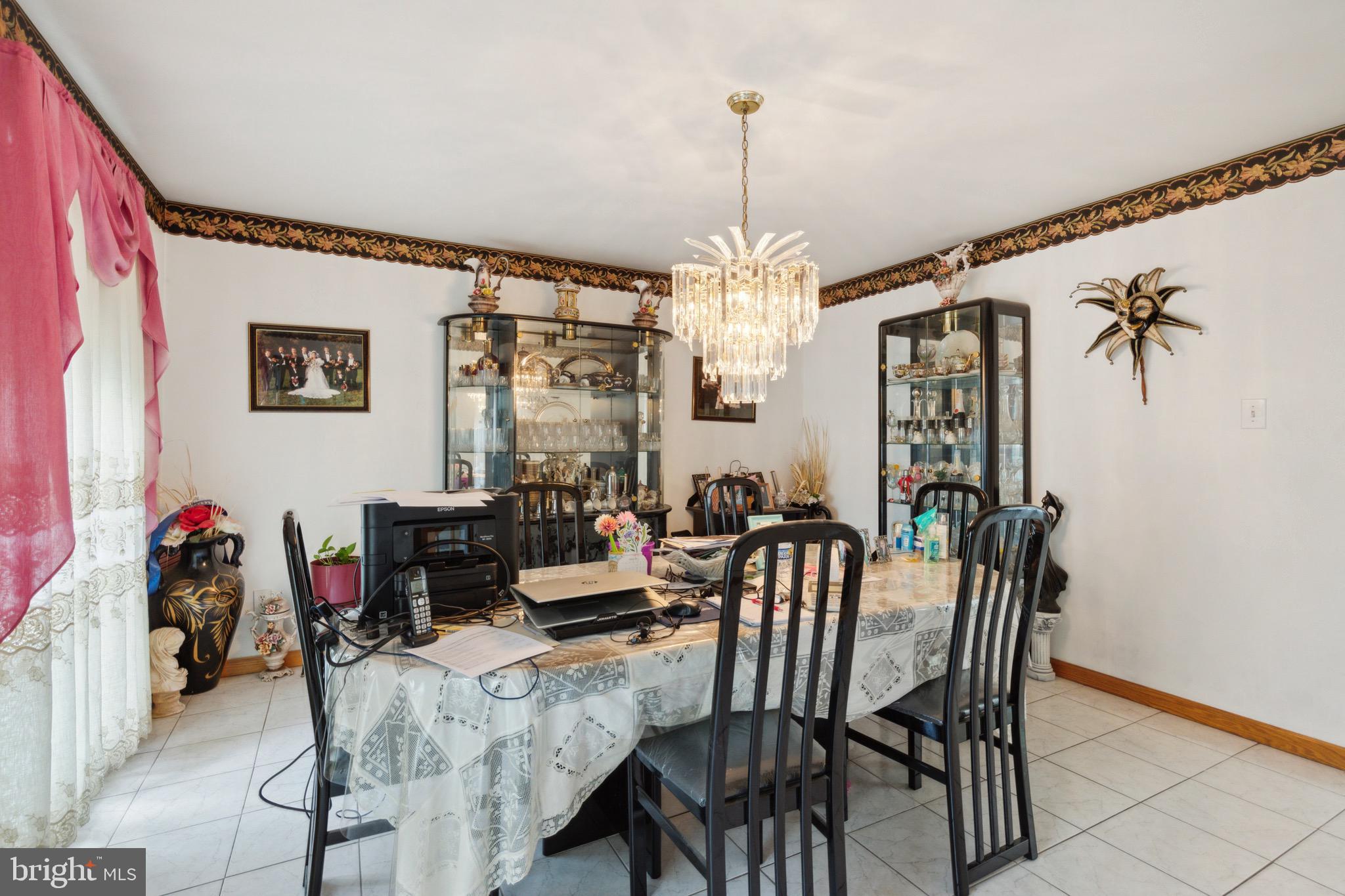 38 Cherry Tree Court Spring City, PA 19475 - Photo 12 of 35 a view of a dining room with furniture and chandelier