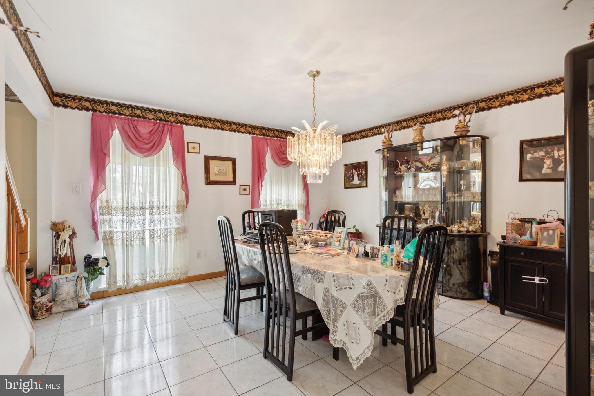 38 Cherry Tree Court Spring City, PA 19475 - Photo 13 of 35 a view of a dining room with furniture and chandelier