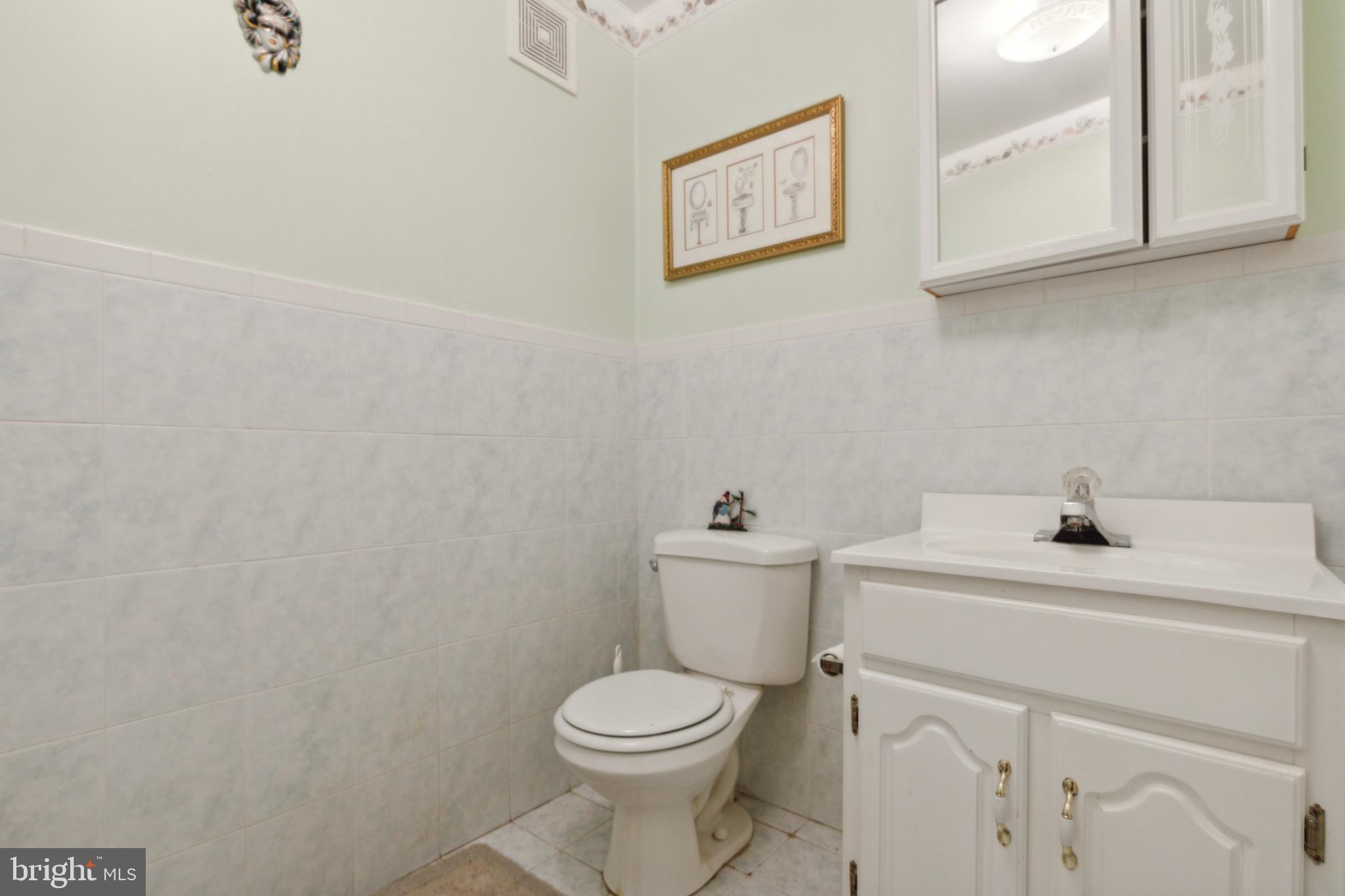 38 Cherry Tree Court Spring City, PA 19475 - Photo 14 of 35 a bathroom with a toilet sink and mirror
