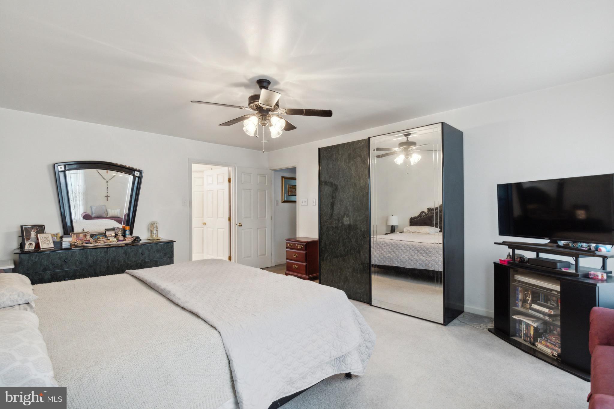 38 Cherry Tree Court Spring City, PA 19475 - Photo 17 of 35 a bedroom with a bed and a flat screen tv