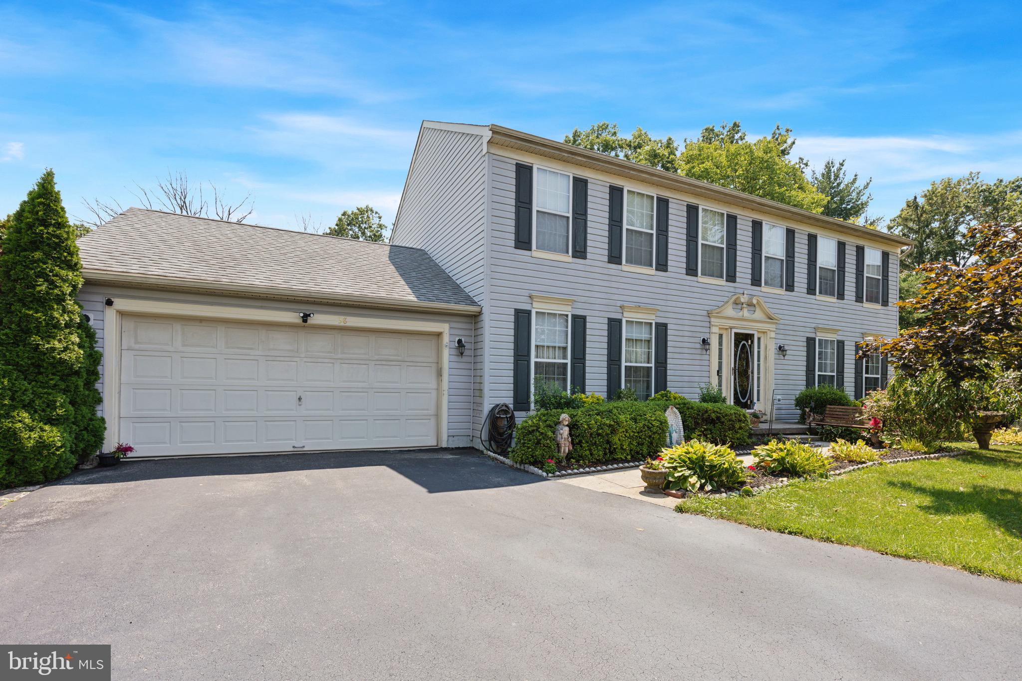 38 Cherry Tree Court Spring City, PA 19475 - Photo 2 of 35 a front view of a house with a yard and garage