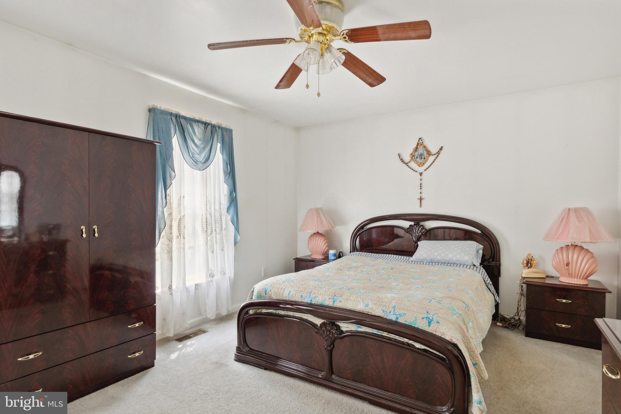 38 Cherry Tree Court Spring City, PA 19475 - Photo 21 of 35 a bedroom with a bed and a chandelier