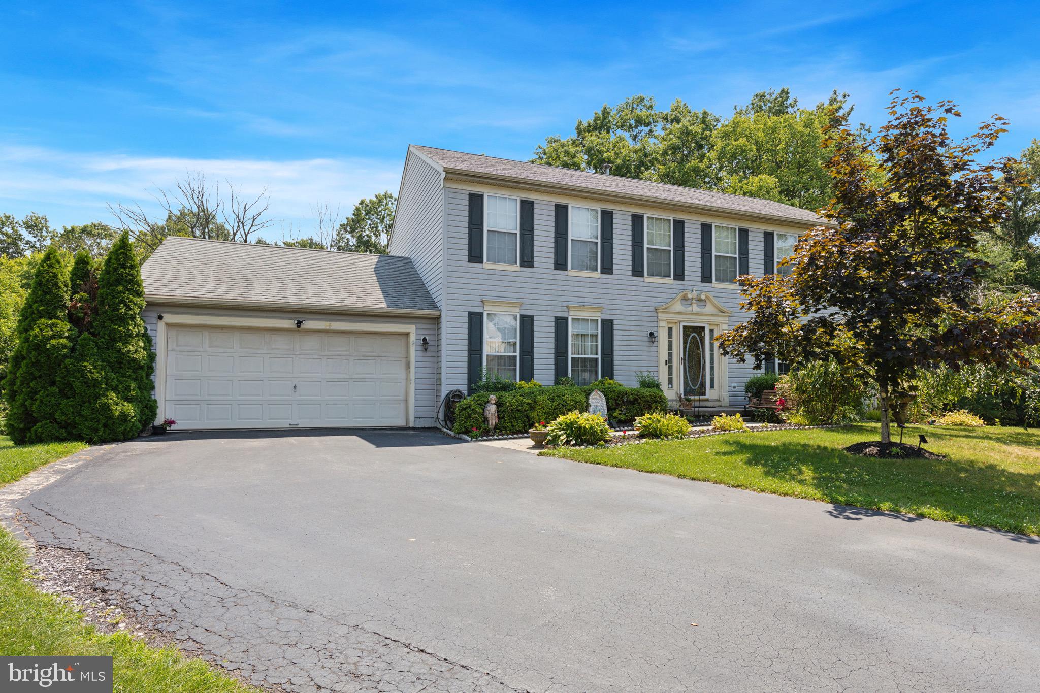 38 Cherry Tree Court Spring City, PA 19475 - Photo 3 of 35 a front view of a house with a yard and garage