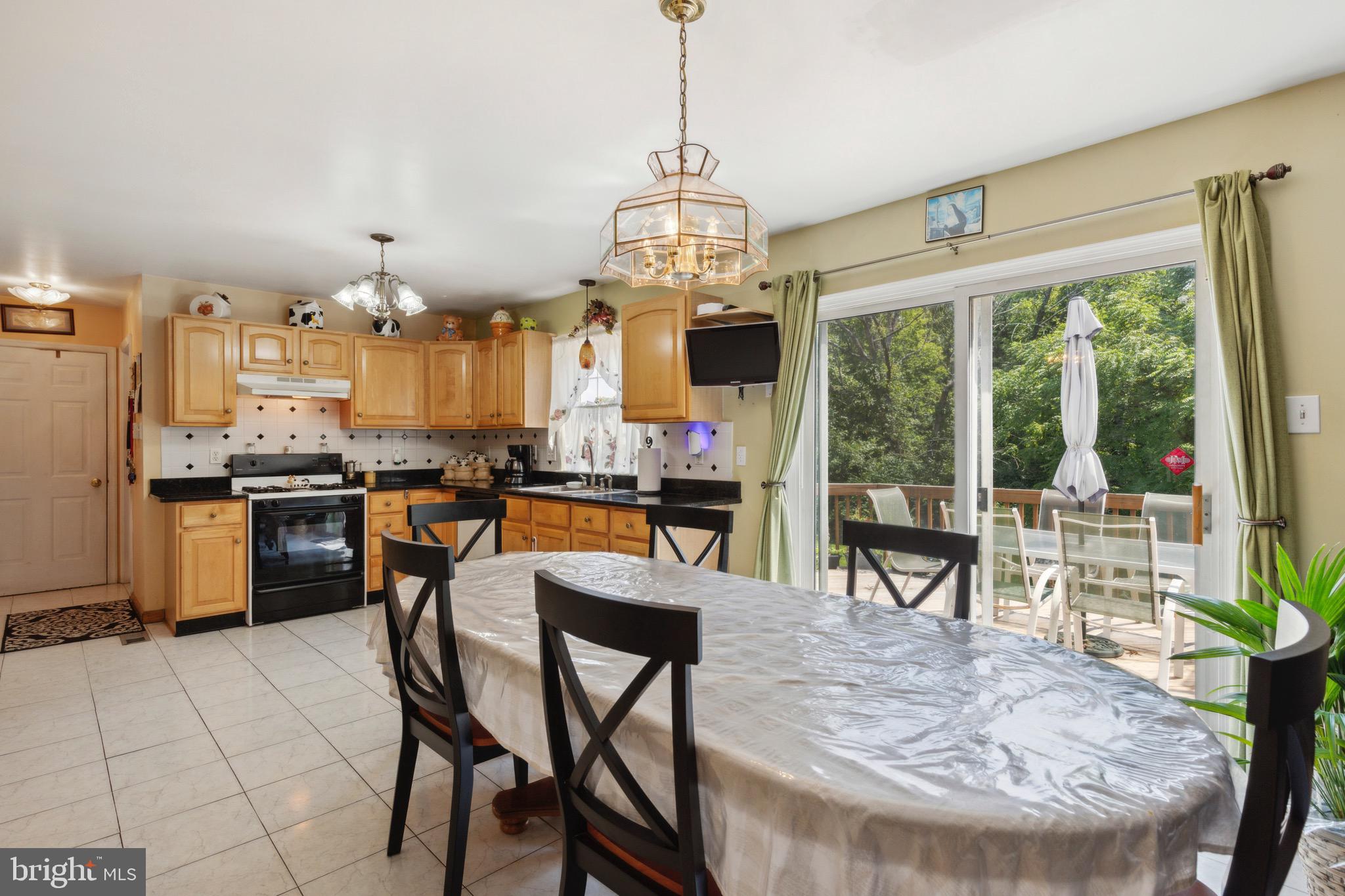 38 Cherry Tree Court Spring City, PA 19475 - Photo 7 of 35 a view of a dining room with furniture large windows and wooden floor