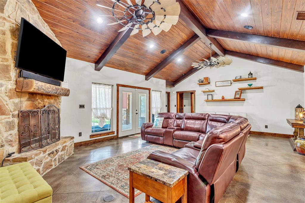 337 County Road 3535 Saltillo, TX 75478 - Photo 14 of 36 a living room with furniture and a flat screen tv