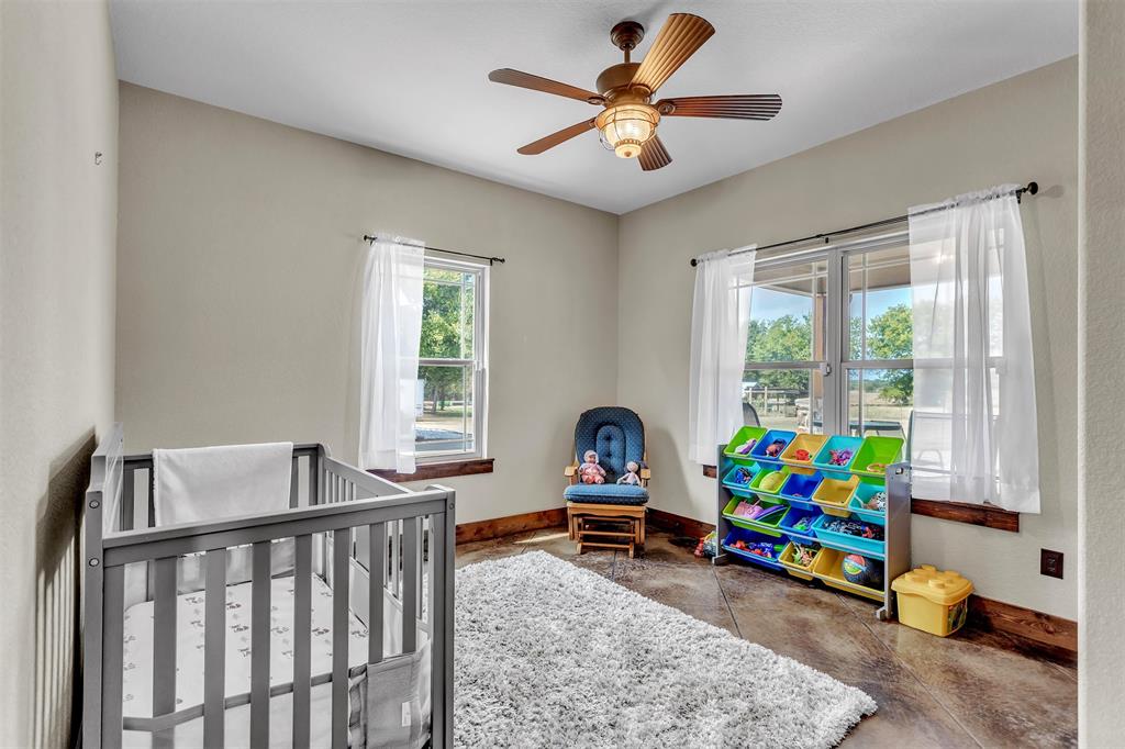 337 County Road 3535 Saltillo, TX 75478 - Photo 20 of 36 a children room with toys and a wooden floor