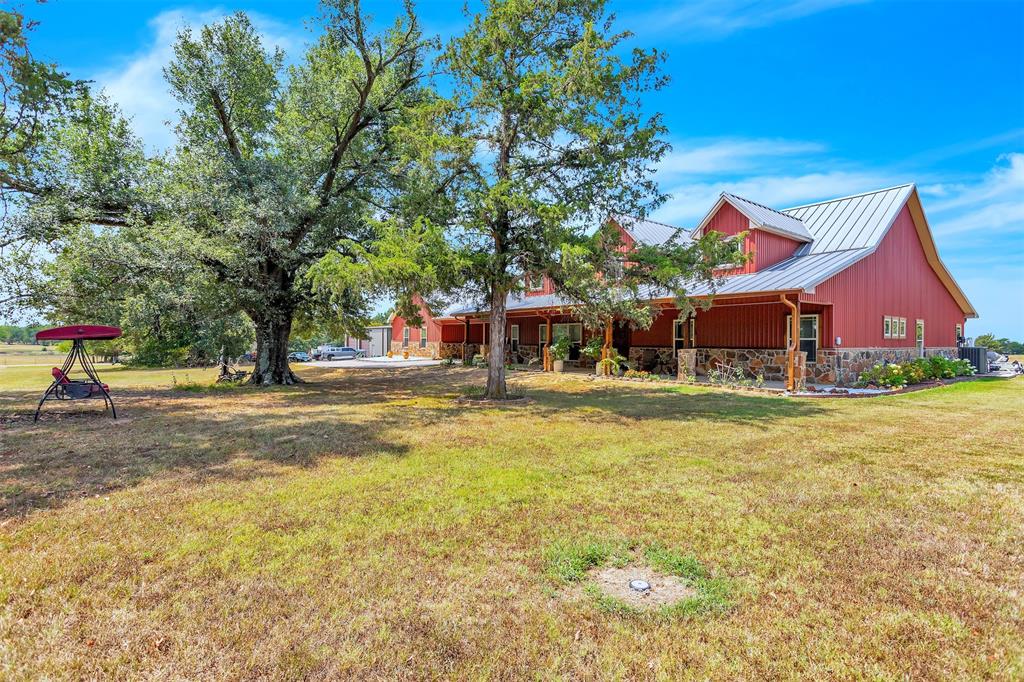 337 County Road 3535 Saltillo, TX 75478 - Photo 2 of 36 a front view of house with yard and swimming pool
