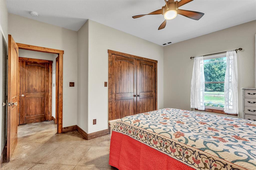 337 County Road 3535 Saltillo, TX 75478 - Photo 23 of 36 a bedroom with a bed and a window