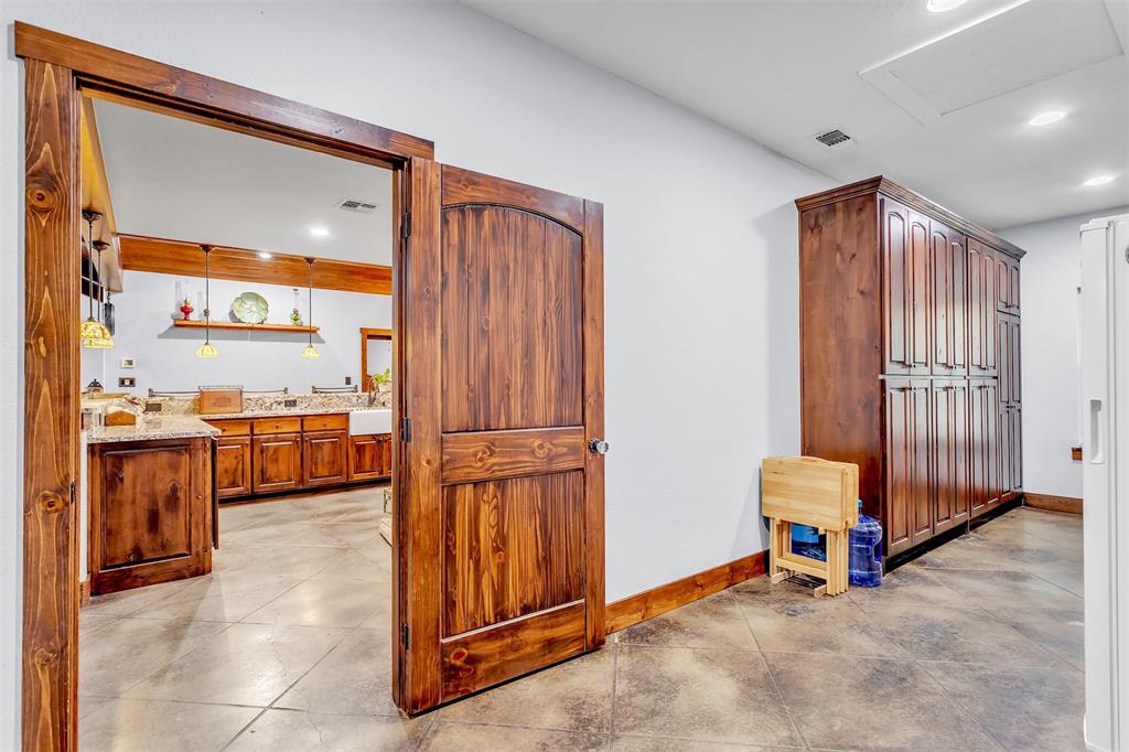 337 County Road 3535 Saltillo, TX 75478 - Photo 26 of 36 a view of a hallway with washer and dryer
