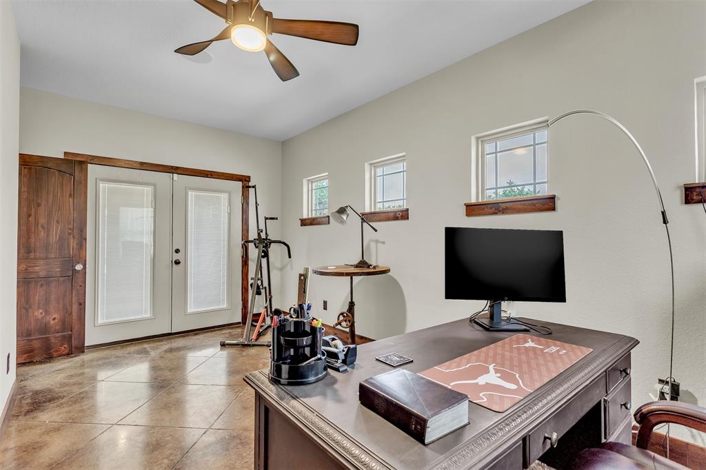 337 County Road 3535 Saltillo, TX 75478 - Photo 29 of 36 a living room with furniture and a flat screen tv
