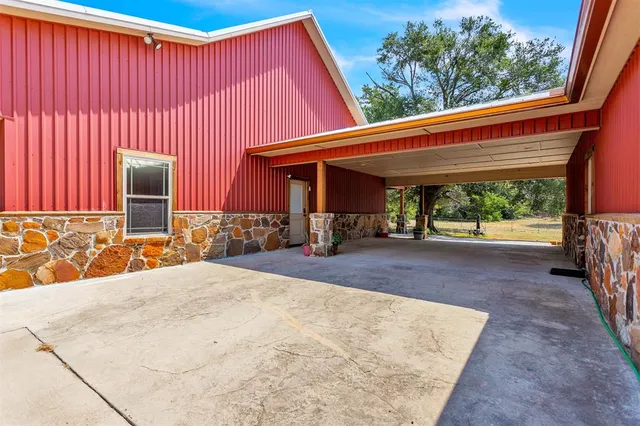an outdoor view of house with patio