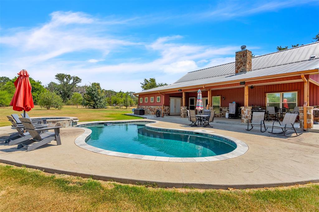 337 County Road 3535 Saltillo, TX 75478 - Photo 6 of 36 a view of swimming pool with seating area and barbeque oven