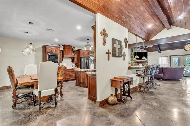 a dining room with furniture and a chandelier