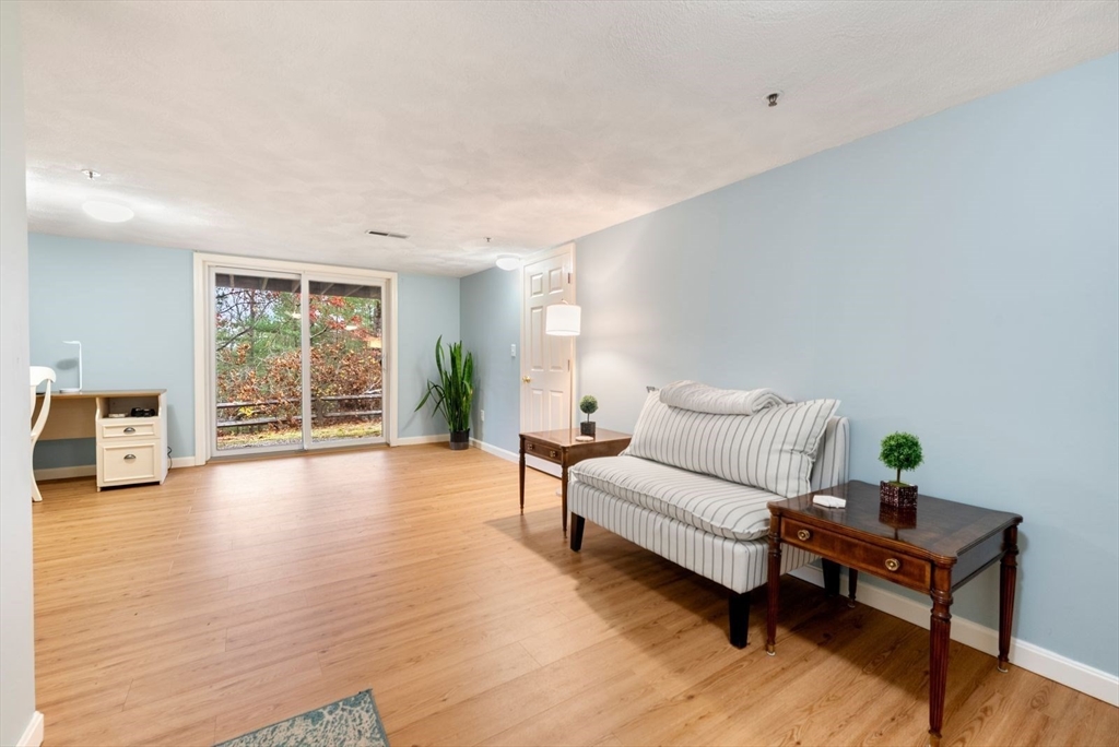 5 Oak Ridge Drive, Unit 7 Maynard, MA 01754 - Photo 16 of 20 a living room with furniture and wooden floor
