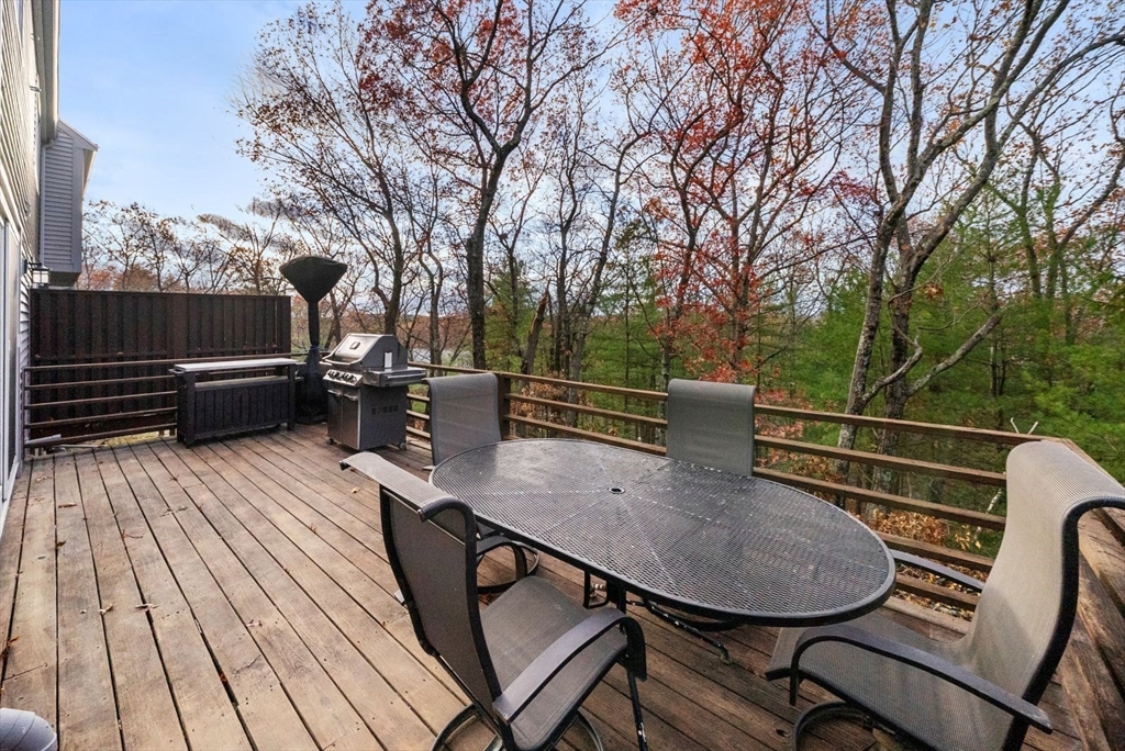 5 Oak Ridge Drive, Unit 7 Maynard, MA 01754 - Photo 18 of 20 a view of balcony with wooden floor and outdoor seating