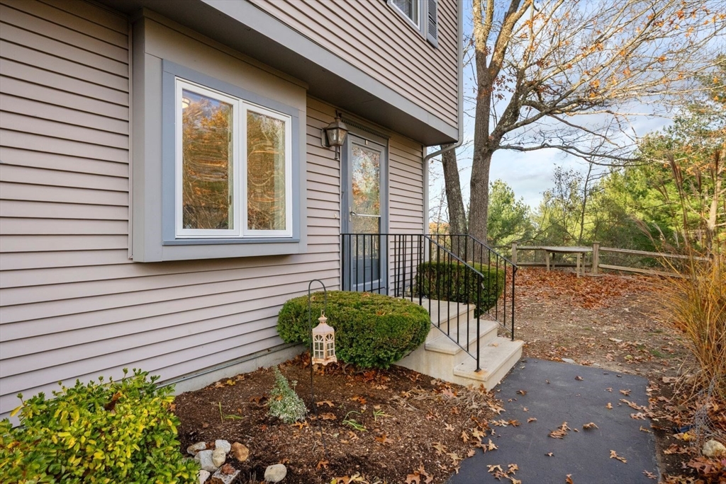 5 Oak Ridge Drive, Unit 7 Maynard, MA 01754 - Photo 2 of 20 a view of a backyard with a garden