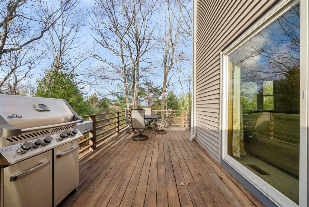 5 Oak Ridge Drive, Unit 7 Maynard, MA 01754 - Photo 4 of 20 a open kitchen with a wooden floor and outdoor seating