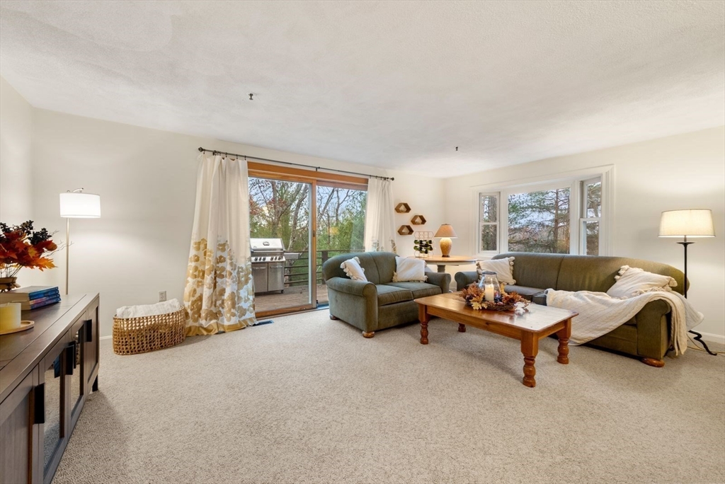 5 Oak Ridge Drive, Unit 7 Maynard, MA 01754 - Photo 5 of 20 a living room with furniture and a large window