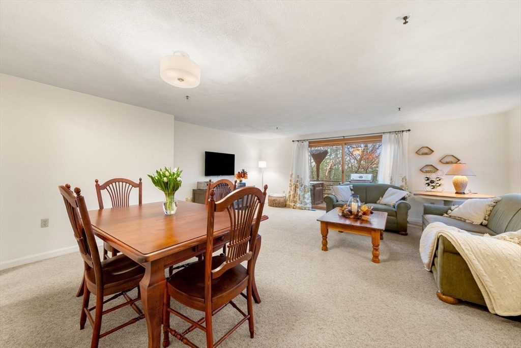 5 Oak Ridge Drive, Unit 7 Maynard, MA 01754 - Photo 6 of 20 a view of a dining room with furniture and a livingroom
