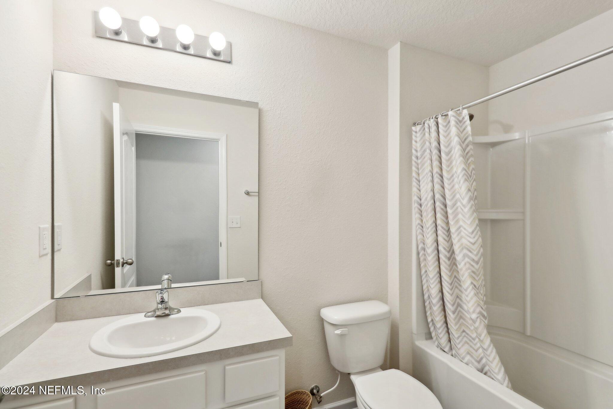 2535 Acorn Creek Road Green Cove Springs, FL 32043 - Photo 15 of 35 a bathroom with a sink toilet and shower