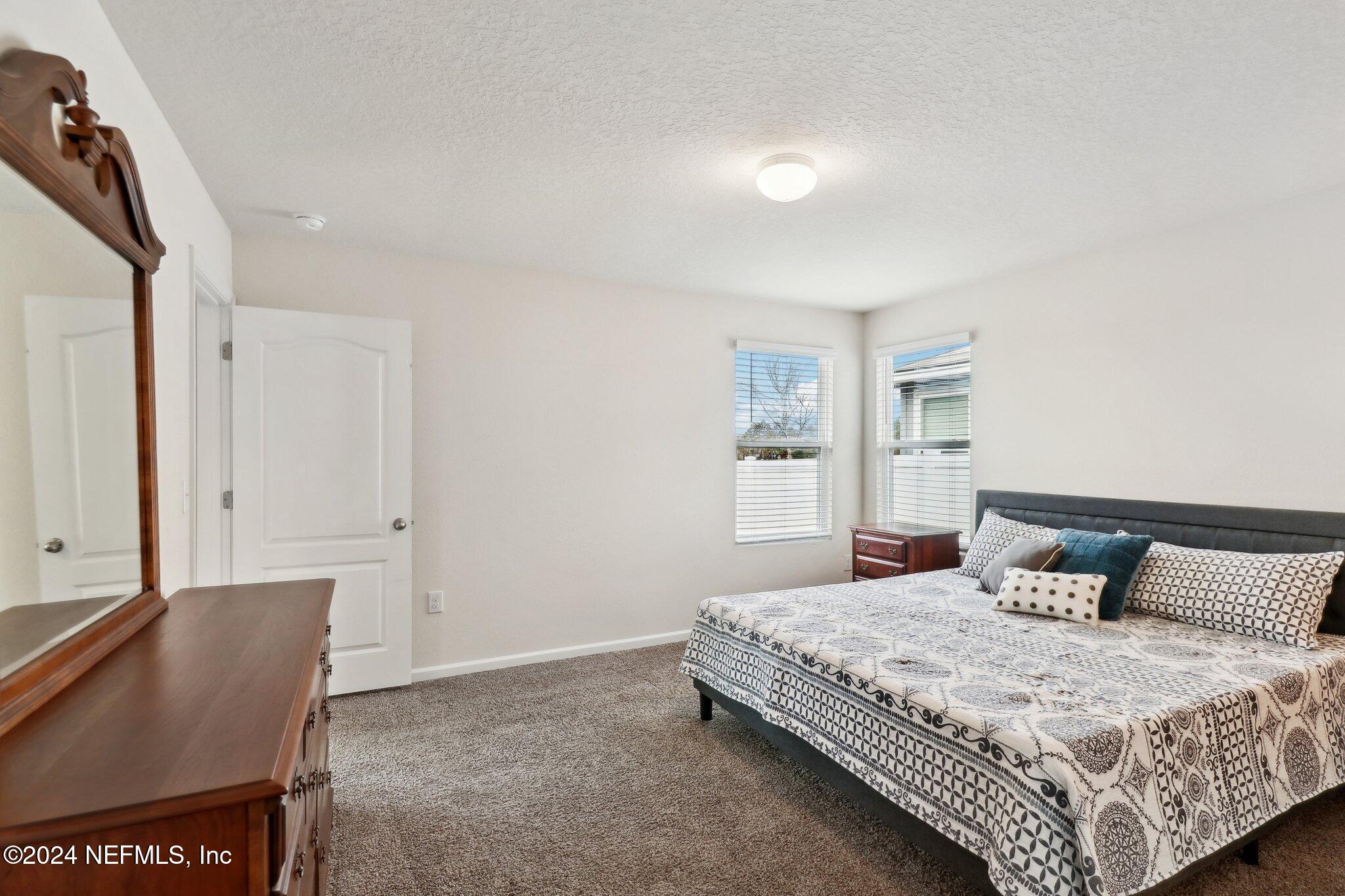 2535 Acorn Creek Road Green Cove Springs, FL 32043 - Photo 21 of 35 a bedroom with a bed and window
