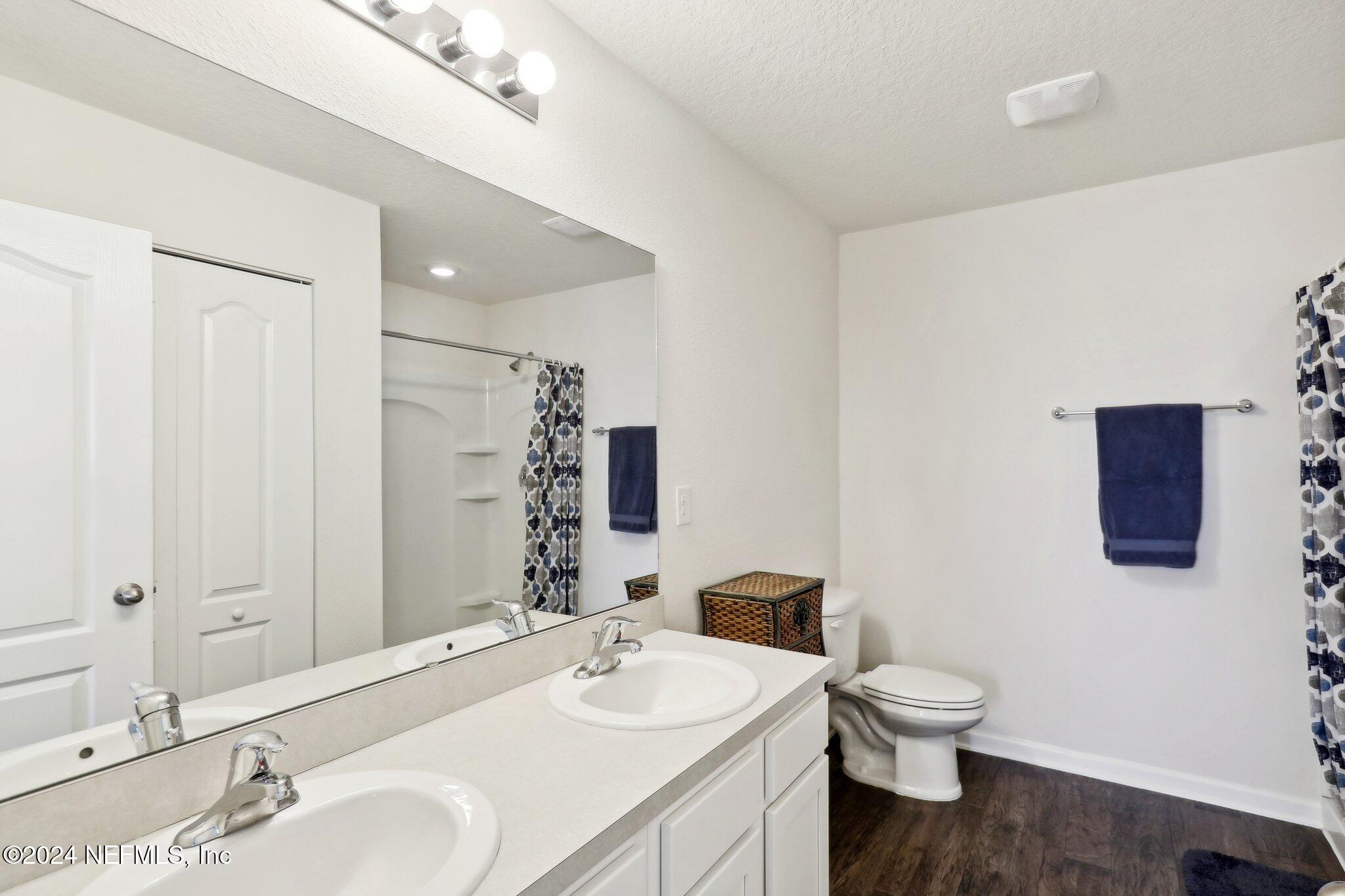 2535 Acorn Creek Road Green Cove Springs, FL 32043 - Photo 23 of 35 a bathroom with a sink toilet and mirror