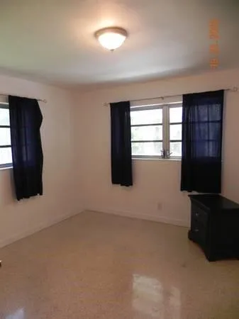 a view of an empty room and window