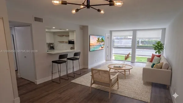 a living room with furniture and a window