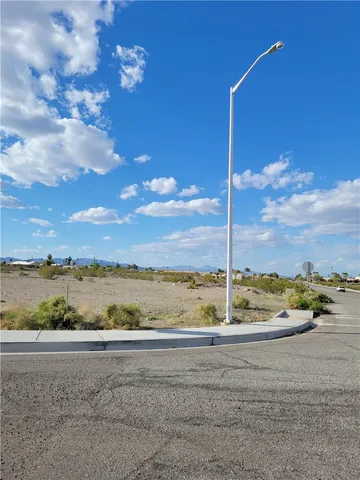 a view of a road with an ocean beach