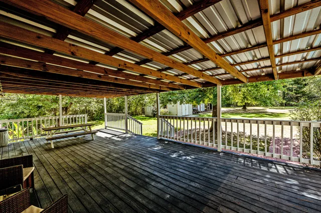 a view of porch with wooden floor