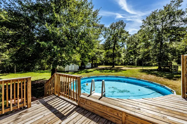 a view of a balcony with wooden floor