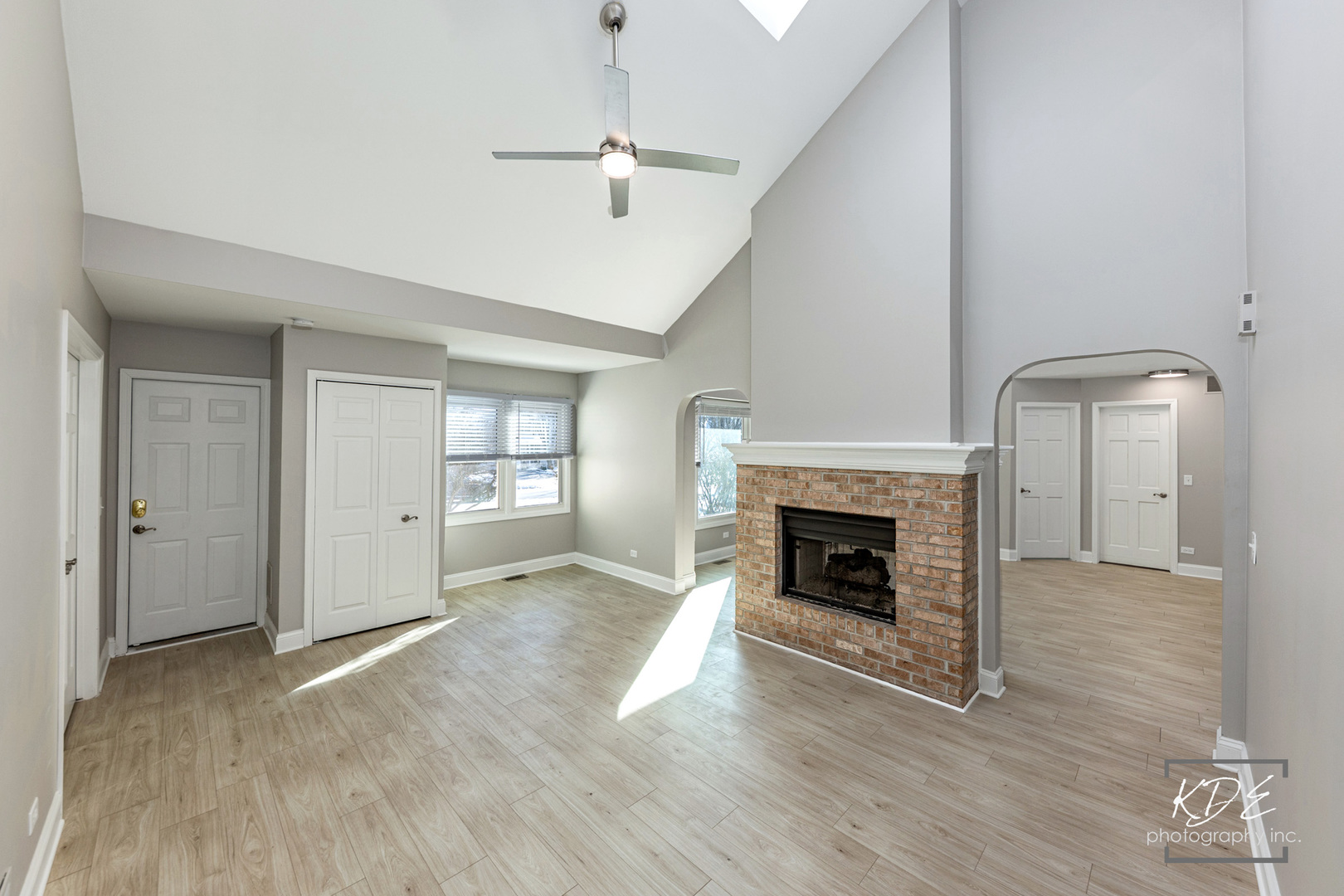 3027 Brossman Street Naperville, IL 60564 - Photo 13 of 42 an empty room with wooden floor fireplace and windows