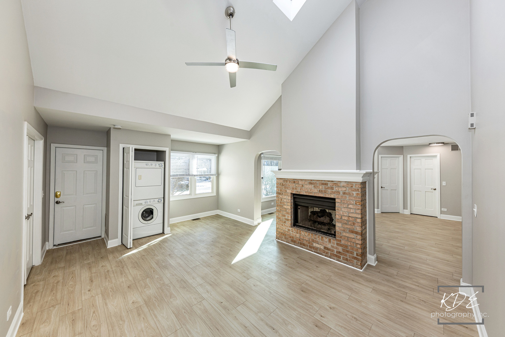 3027 Brossman Street Naperville, IL 60564 - Photo 14 of 42 an empty room with wooden floor fireplace and windows