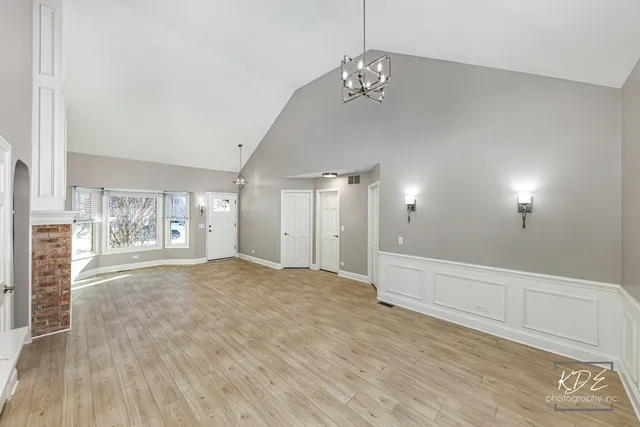 a kitchen with white cabinets stainless steel appliances and sink