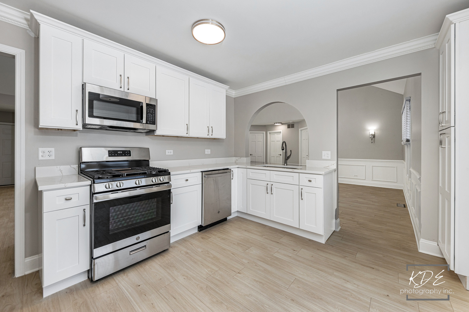 3027 Brossman Street Naperville, IL 60564 - Photo 9 of 42 a kitchen with white cabinets stainless steel appliances and sink