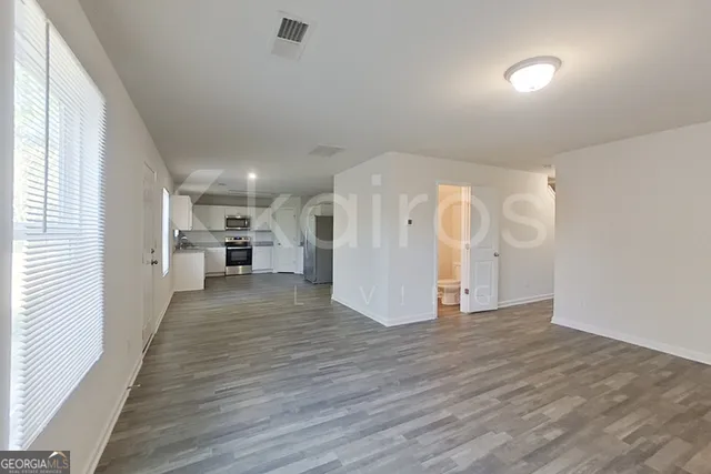 a view of a livingroom with wooden floor