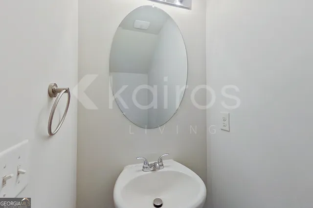 a bathroom with a sink and mirror