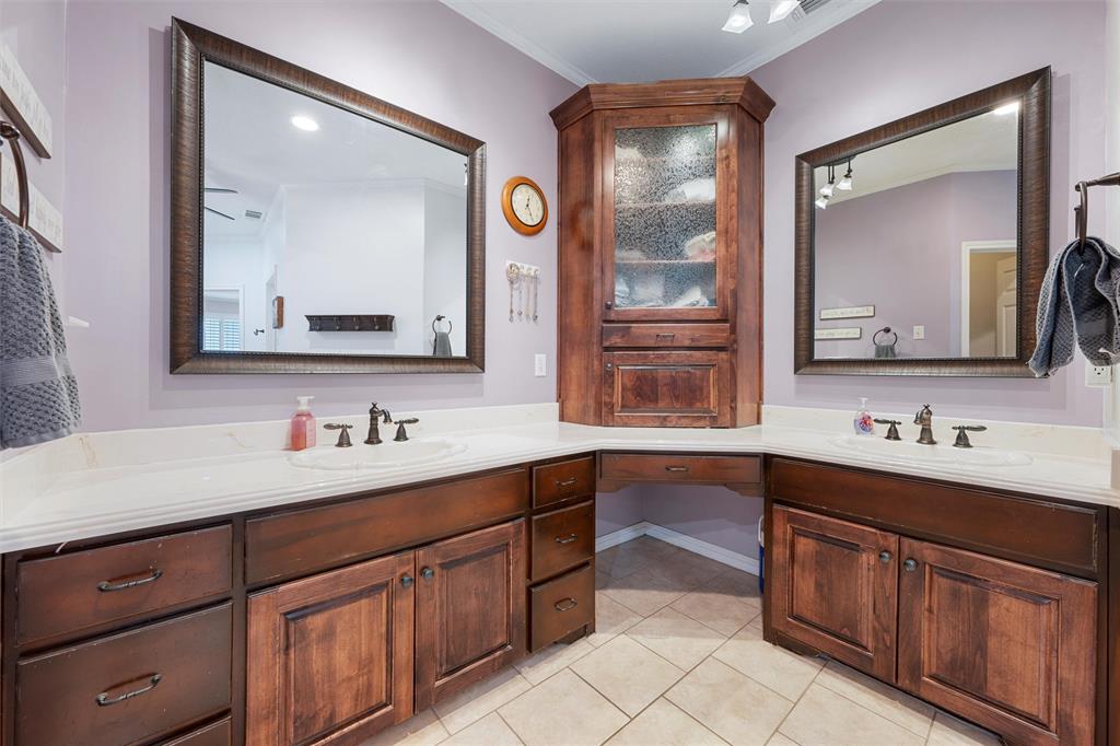 175 Winding Trail Crawford, TX 76638 - Photo 23 of 40 a bathroom with a sink vanity and mirror