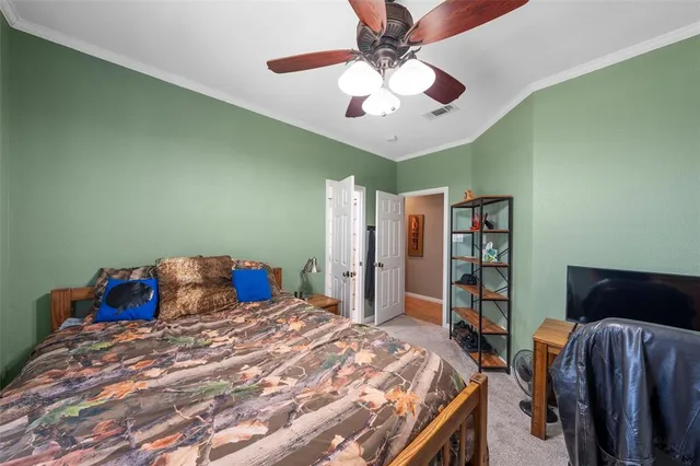 a en suite bathroom with a double vanity sink and a mirror