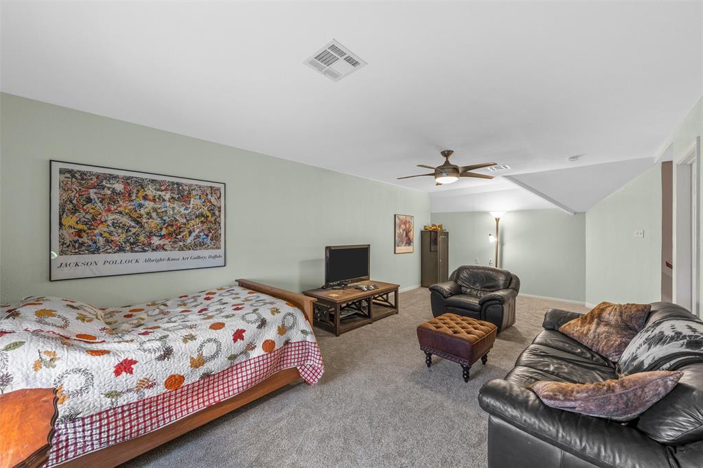 175 Winding Trail Crawford, TX 76638 - Photo 33 of 40 a bedroom with bed couch and window