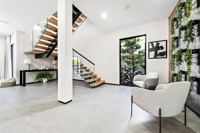 a view of livingroom with furniture and stairs