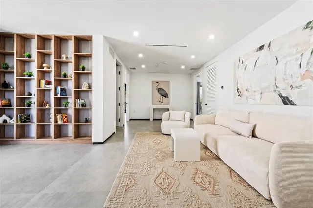 a living room with furniture and white walls