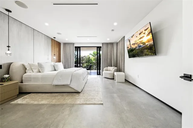 a living room with couches and a flat screen tv