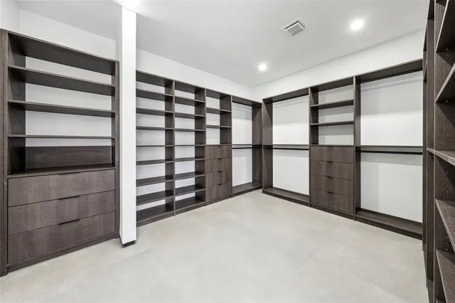 a view of an empty room with a cabinet