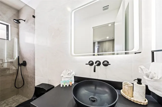 a bathroom with a sink and mirror