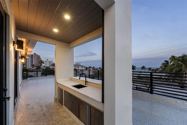a kitchen with stainless steel appliances granite countertop a stove and a sink