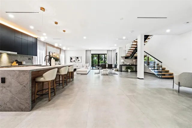 a living room with lots of furniture and a flat screen tv