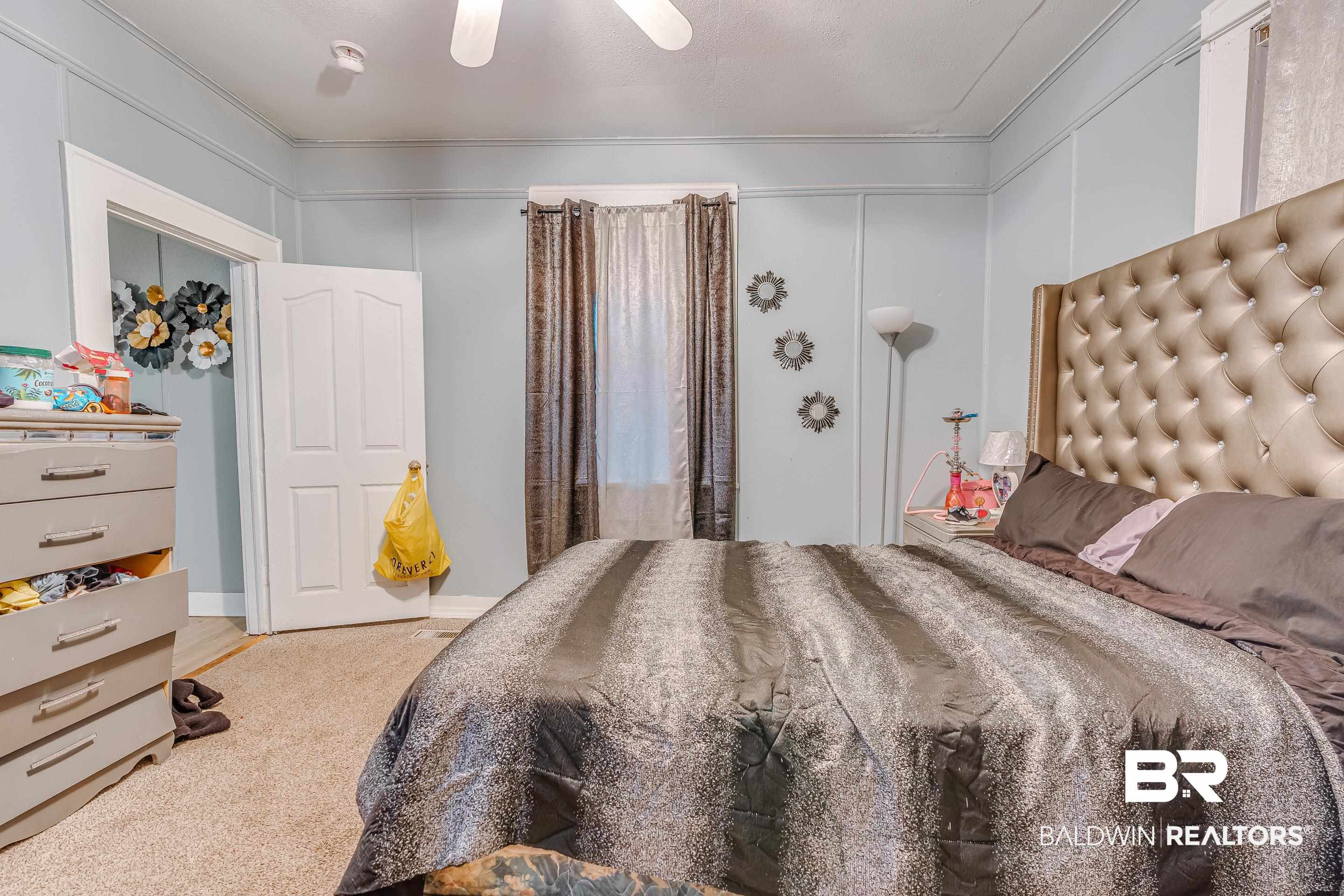 14 Southern Street Mobile, AL 36611 - Photo 11 of 26 Bedroom featuring ceiling fan and carpet