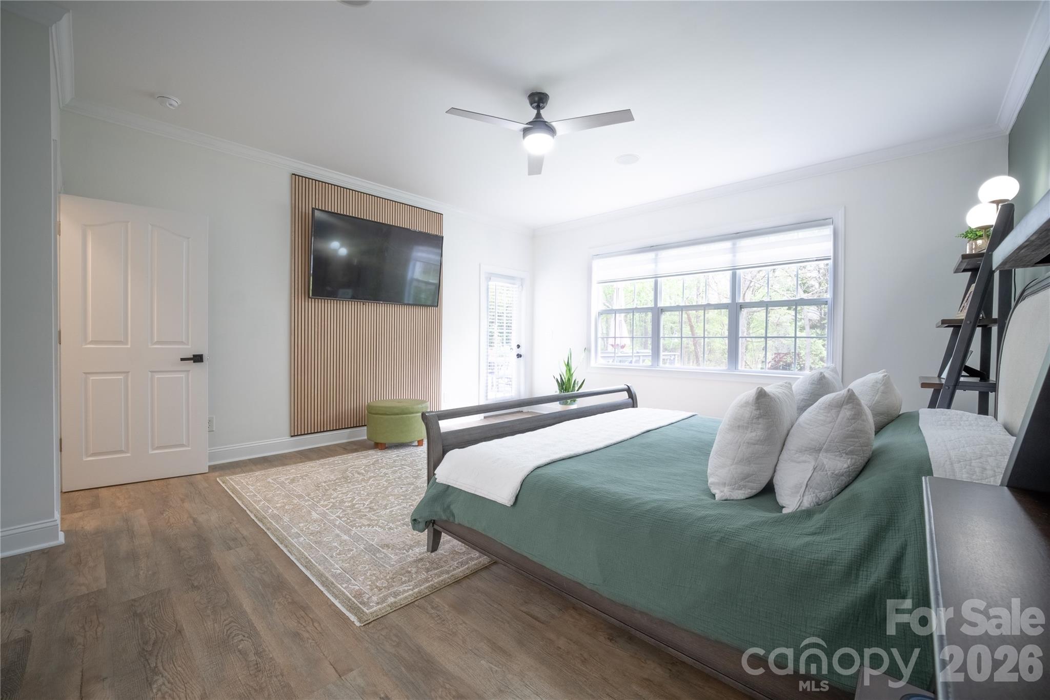 12058 Pelican Court Tega Cay, SC 29708 - Photo 14 of 43 a bedroom with a large bed and a window