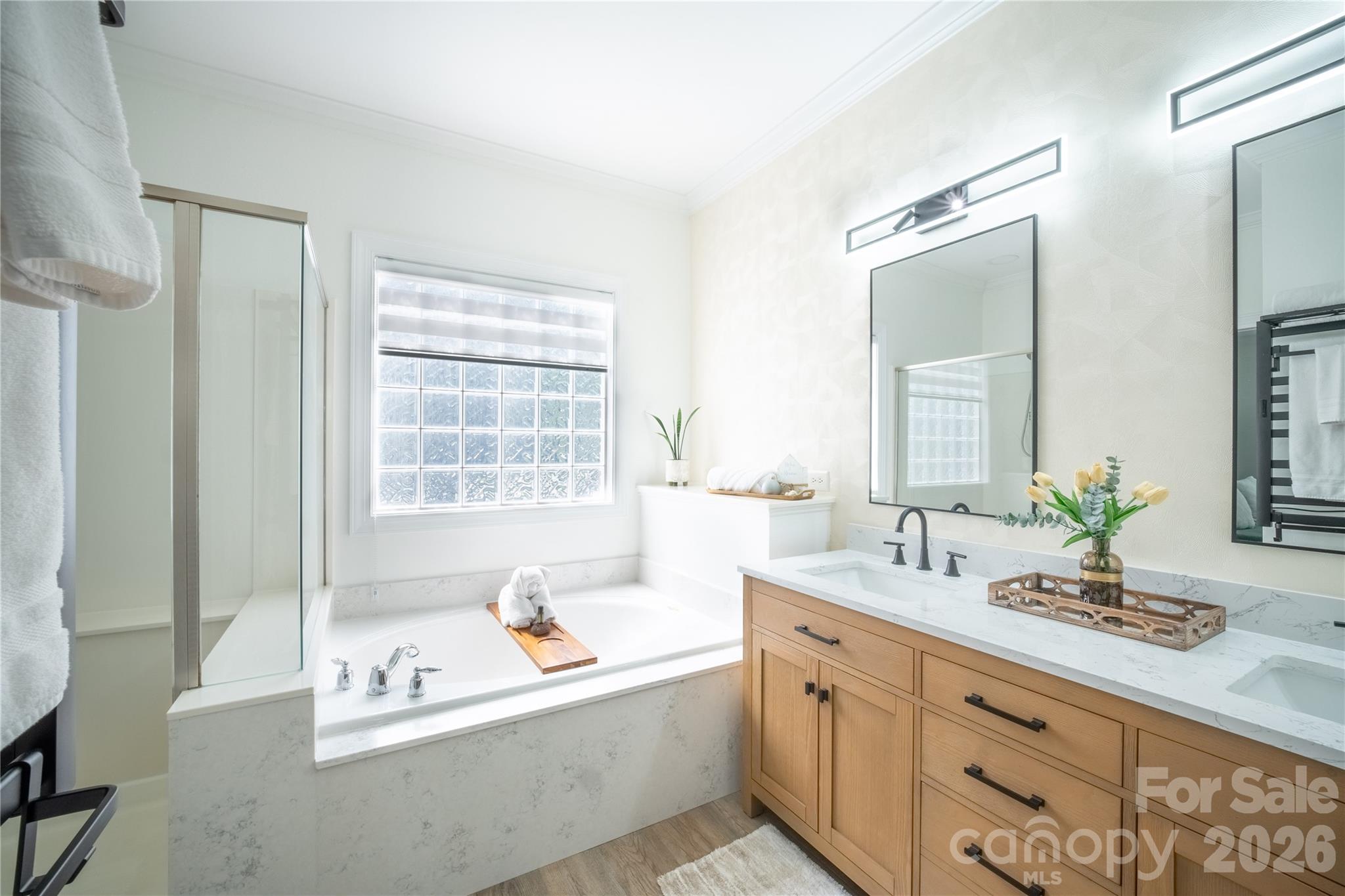 12058 Pelican Court Tega Cay, SC 29708 - Photo 15 of 43 a spacious bathroom with sink shower and bathtub